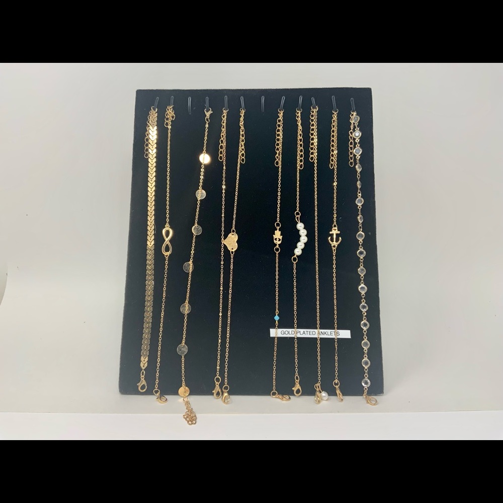 Ten gold plated anklets in different styles